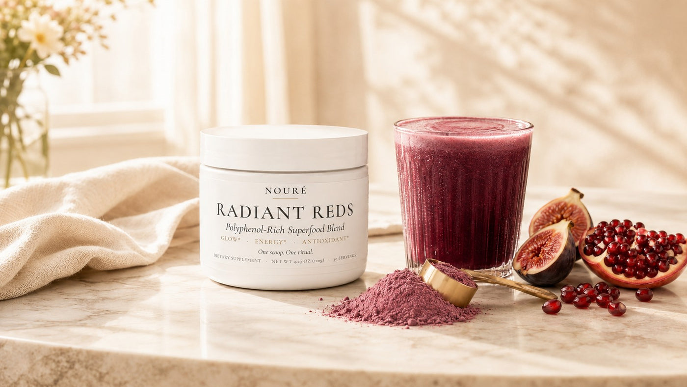 Radiant Reds by NOURÉ, a polyphenol glow blend with a berry smoothie in morning light